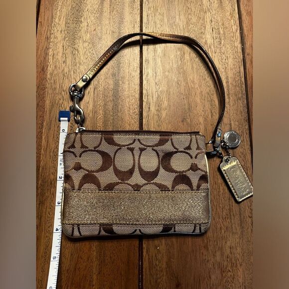 Coach Brown and Tan Signature Wristlet with gold stripe. Vintage 
4x6 inches